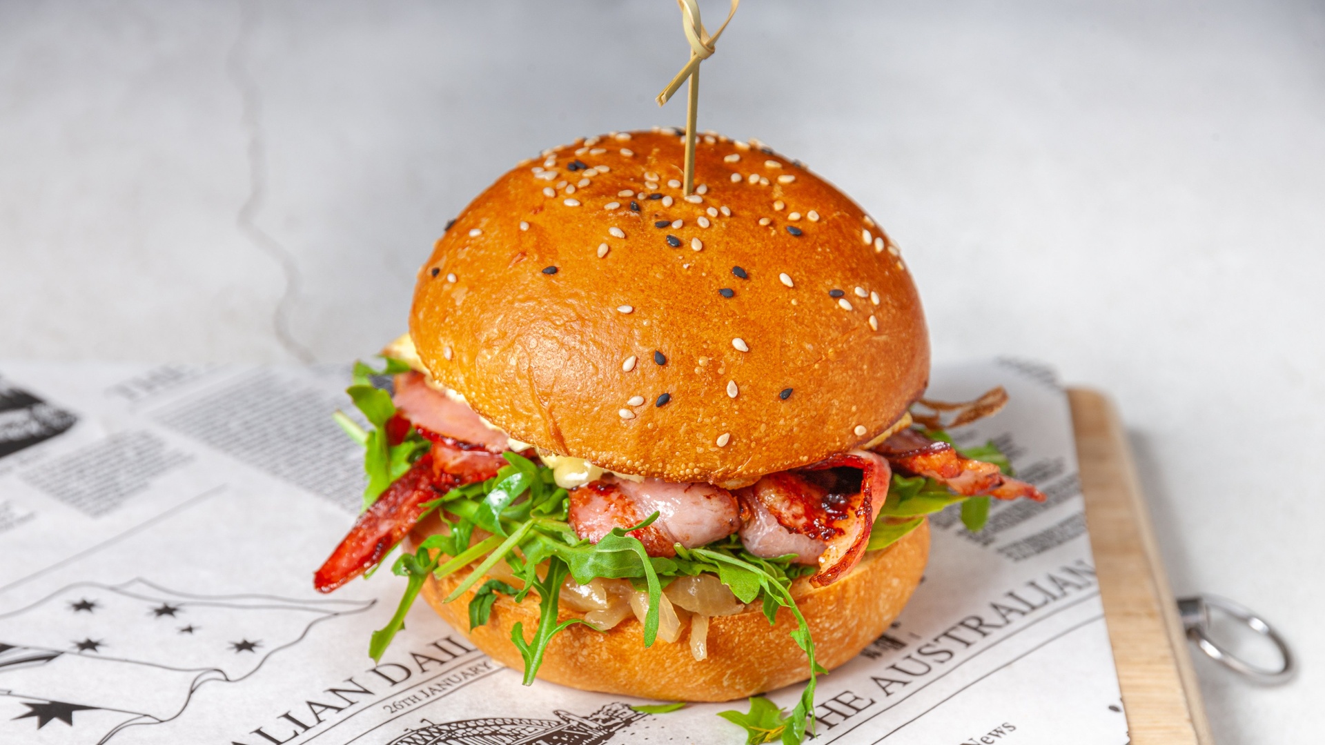Morning burger with bacon, omelette and chilli aioli on brioche